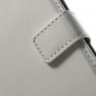 Nokia Lumia 830 atverčiamas baltas odinis dėklas - piniginė