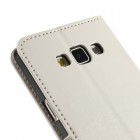 Samsung Galaxy A7 atverčiamas baltas odinis dėklas - piniginė